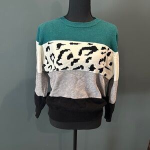 Green and White Crew Neck Sweater with Bold Patterns